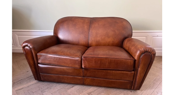 2-seater leather sofa club vintage brown armchair with piping on the armrests