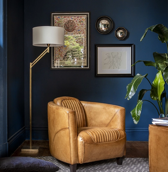 Gold articulated living room floor lamp with ivory lampshade