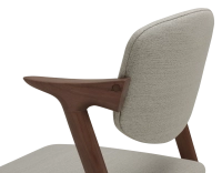 Walnut coloured design chair and natural beige fabric Walnut coloured design chair and natural beige fabric