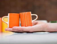 Tasse à café en céramique striée orange Tasse à café en céramique striée orange