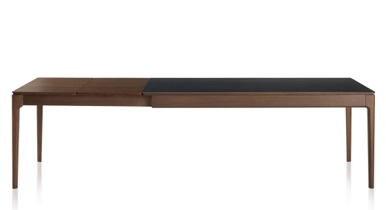 Extendable table for 8 to 10 people in oak and ceramic with wooden extensions with dark brown stained wood and plain black ceramic top 180x90 cm