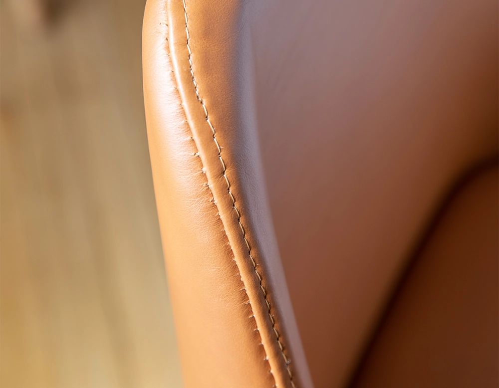 Designer chair natural stained wood and caramel leather Designer chair natural stained wood and caramel leather