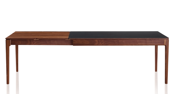 Extending table for 8 to 12 people in walnut and ceramic with wooden extensions with natural stained wood and plain black ceramic top 210x90 cm