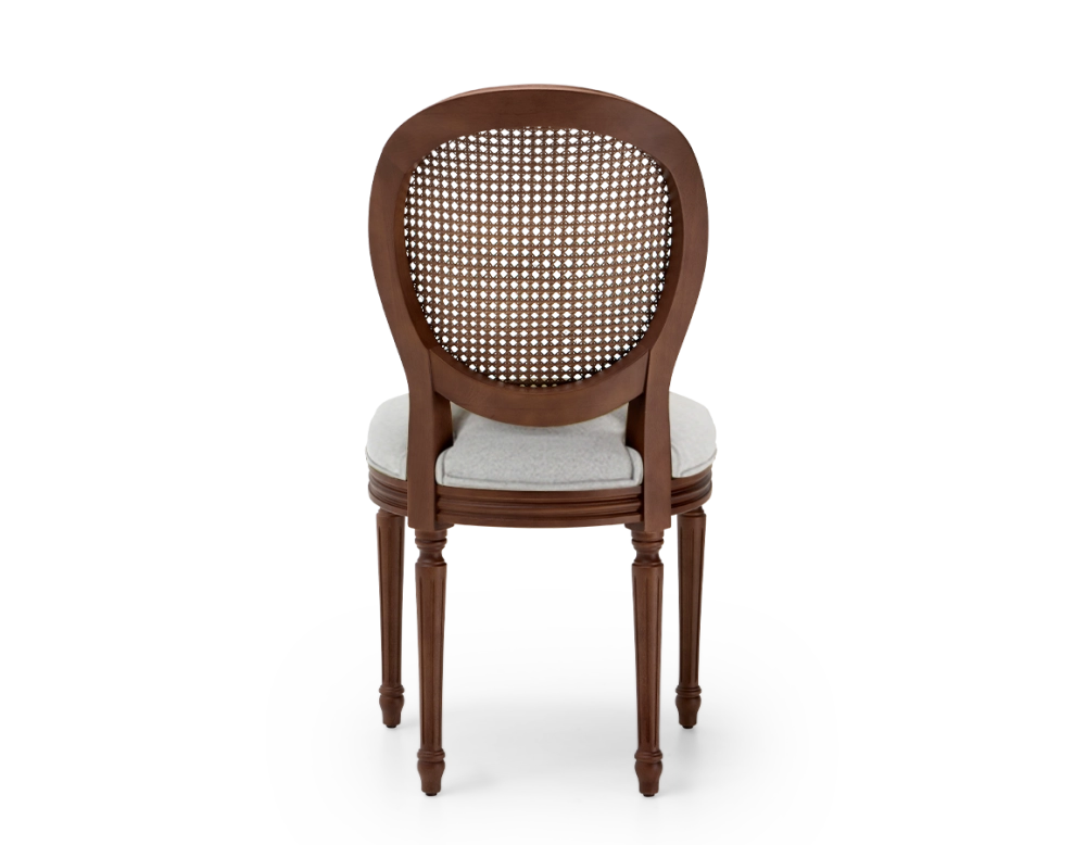 Louis XVI style antique chair dark brown stained wood with cane backrest and light grey fabric seat. Louis XVI style antique chair dark brown stained wood with cane backrest and light grey fabric seat.