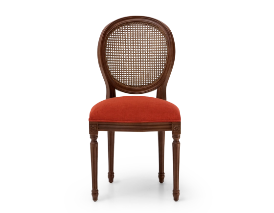 Louis XVI style antique chair dark brown stained wood with cane backrest and burnt orange fabric seat.