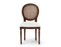 Louis XVI style antique chair dark brown stained wood with cane backrest and white bouclé fabric seat. Louis XVI style antique chair dark brown stained wood with cane backrest and white bouclé fabric seat.