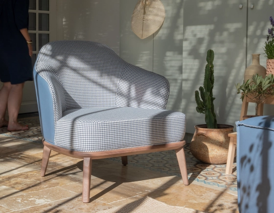 Designer armchair blue storm leather and blue and white houndstooth fabric