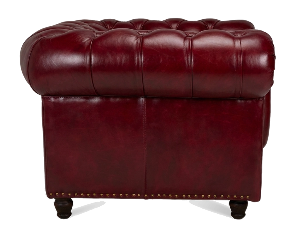 Sillón Chesterfield de piel rojo carmín reposabrazos con tachuelas