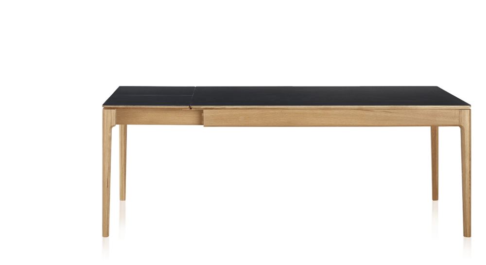 Extendable table for 8 to 12 people in oak and ceramic with ceramic extensions with natural stained wood and plain black ceramic top and extensions 180x100 cm