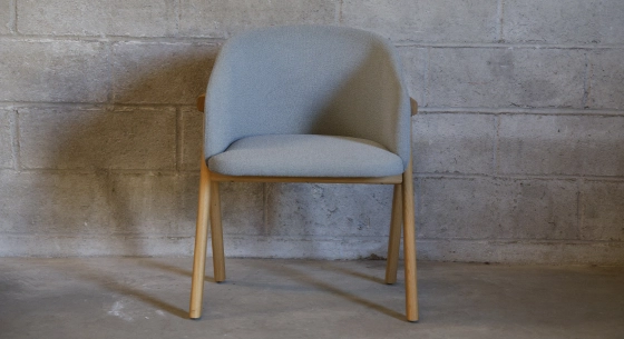 Oak chair design wood stained in xxxxx, seat upholstered in xxxxxx.