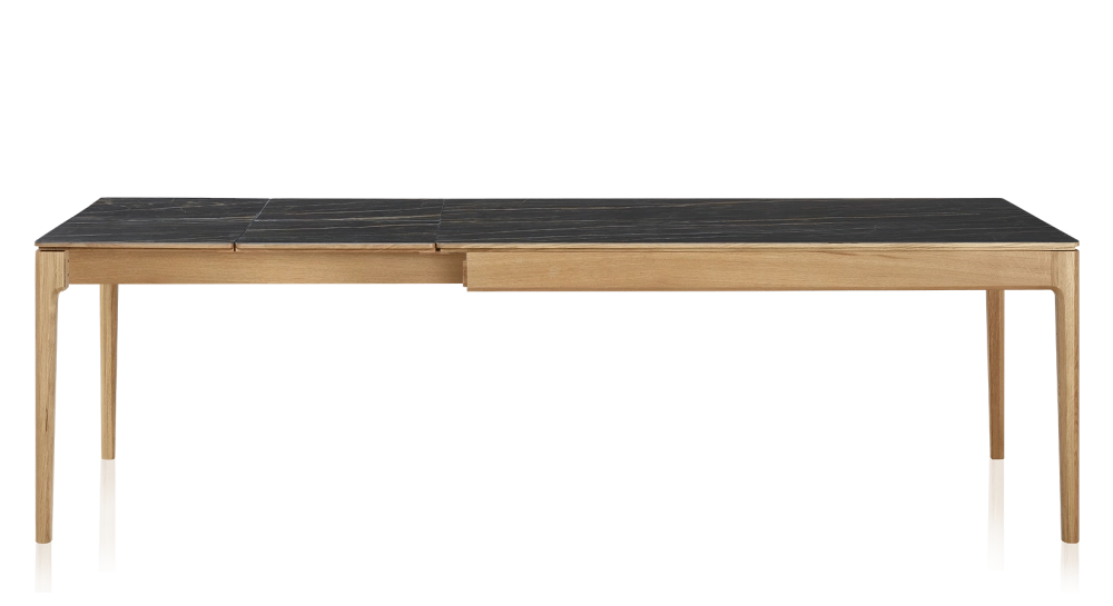 Extendable table for 8 to 12 people in oak and ceramic with ceramic extensions with natural stained wood and black marble effect ceramic top and extensions 180x100 cm