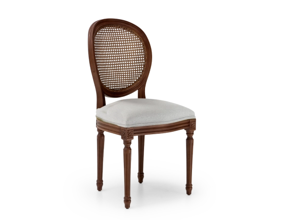 Louis XVI style antique chair dark brown stained wood with cane backrest and light grey fabric seat.