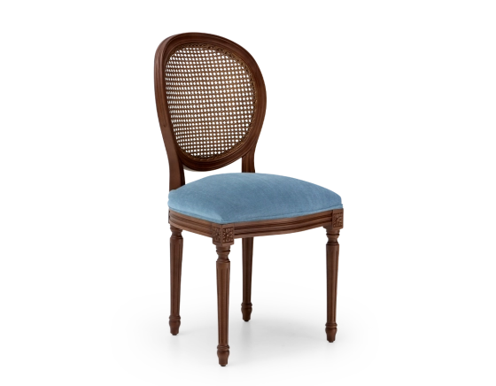 Louis XVI style antique chair dark brown stained wood with cane backrest and denim blue fabric seat.