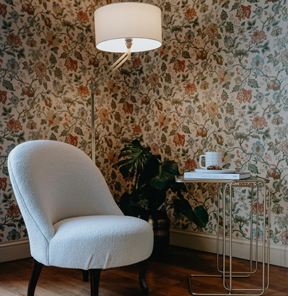 Gold articulated living room floor lamp with ivory lampshade