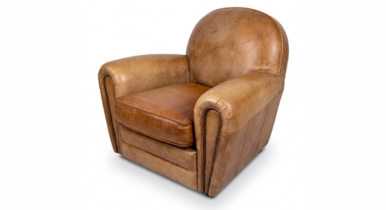 Fauteuil club cuir cognac accoudoirs cloutés