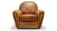 Fauteuil club cuir cognac accoudoirs cloutés