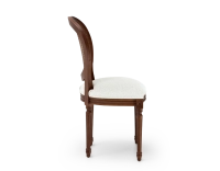 Louis XVI style antique chair dark brown stained wood with cane backrest and white bouclé fabric seat. Louis XVI style antique chair dark brown stained wood with cane backrest and white bouclé fabric seat.