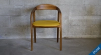 Scandinavian chair walnut wood with a pale yellow fabric seat