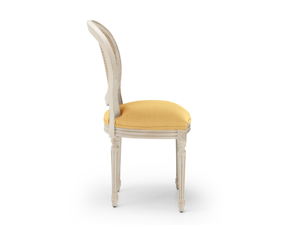 Louis XVI style antique chair white cerused wood with cane back and yellow fabric seat Louis XVI style antique chair white cerused wood with cane back and yellow fabric seat