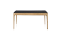 Extendable table for 8 to 14 people in oak and ceramic with ceramic extensions with natural stained wood and plain black ceramic top and extensions 210x100 cm