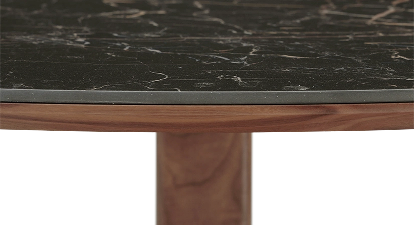 Round walnut and ceramic dining table for 6 people with a natural wood finish and a black m2 marble-effect ceramic top. 120x120 Round walnut and ceramic dining table for 6 people with a natural wood finish and a black m2 marble-effect ceramic top. 120x120