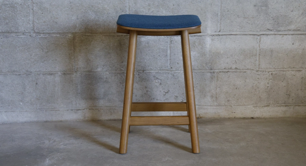 Design bar stool H65 cm natural wood finish with blue fabric seat