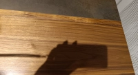 Table extensible 6 à 8 personnes en noyer et céramique allonges bois avec bois teinte naturelle et plateau céramique brun oxydé