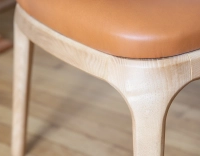 Designer chair natural stained wood and caramel leather Designer chair natural stained wood and caramel leather