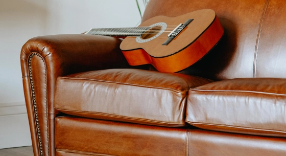 2 seater leather club sofa light brown studded armrests