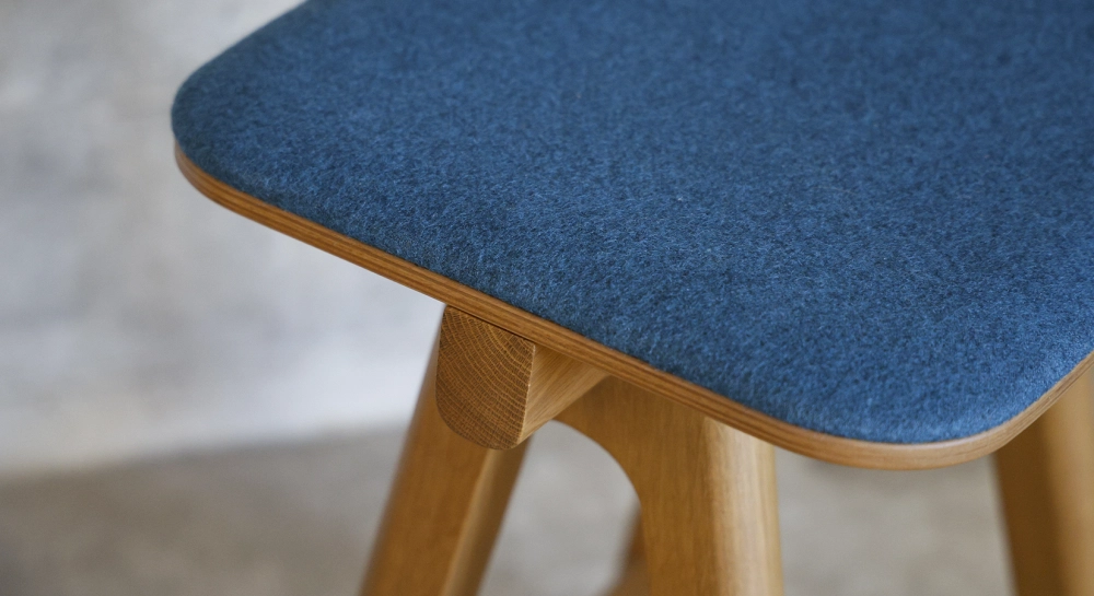 Design bar stool H65 cm natural wood finish with blue fabric seat