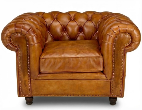 Fauteuil Chesterfield cuir cognac accoudoirs cloutés