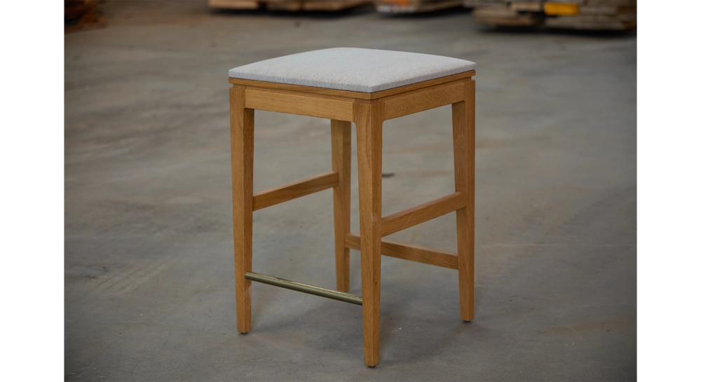Design bar stool H65 cm natural wood finish with beige fabric seat Design bar stool H65 cm natural wood finish with beige fabric seat