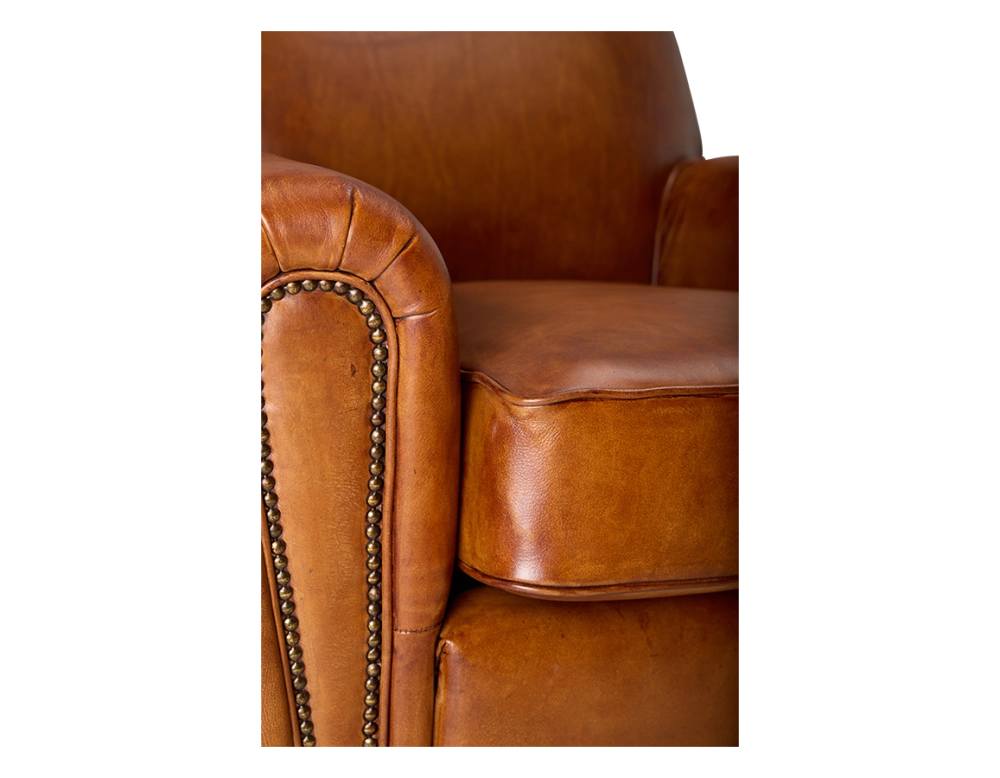 Leather club armchair light brown studded armrests Leather club armchair light brown studded armrests