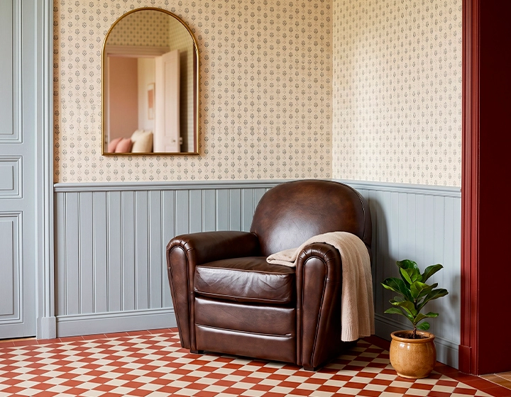 Leather club armchair dark brown piped armrests