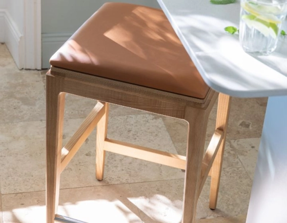 H80 cm designer bar stool natural tint wood, caramel leather seat