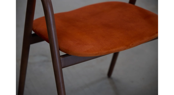 Scandinavian chair walnut wood with terracotta fabric seat.