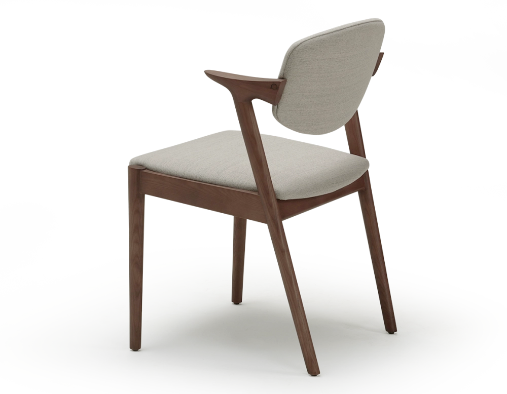Walnut coloured design chair and natural beige fabric Walnut coloured design chair and natural beige fabric