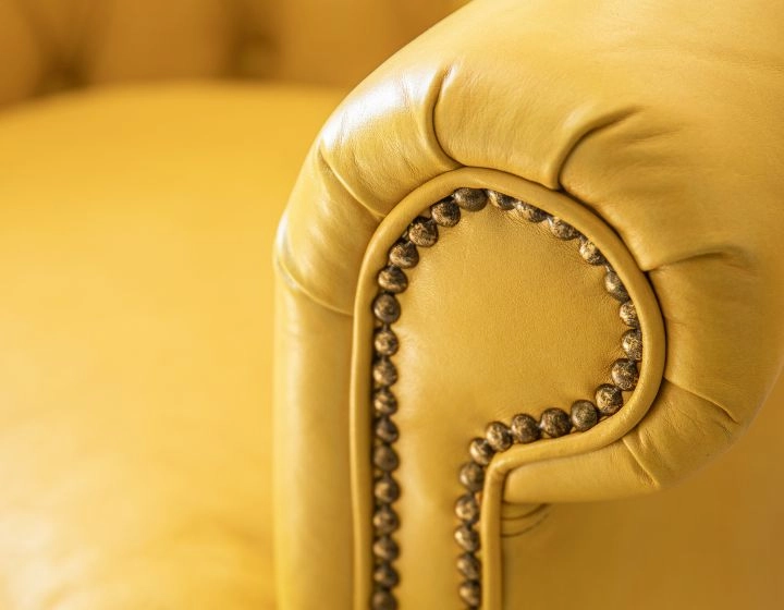 Chesterfield leather armchair yellow studded armrests Chesterfield leather armchair yellow studded armrests